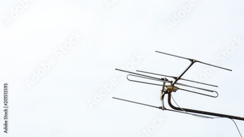 television antenna on blue sky in the morning