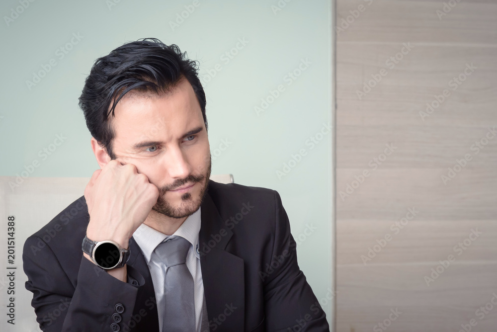 Young depressed stressed businessman working at office Young depressed stressed businessman working at office