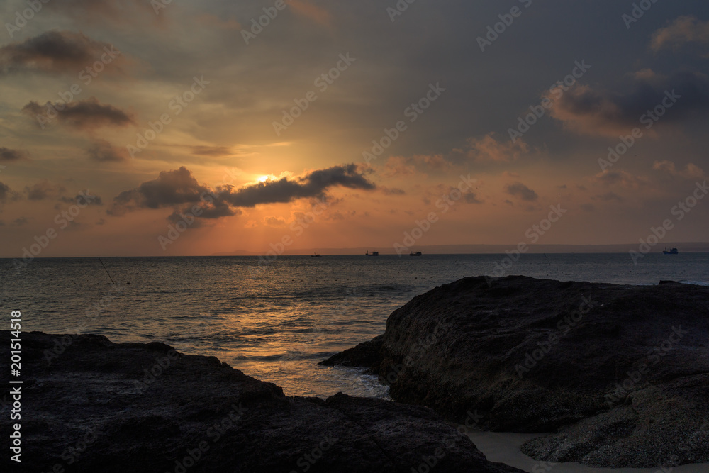 fishing boat to the sea at sunset