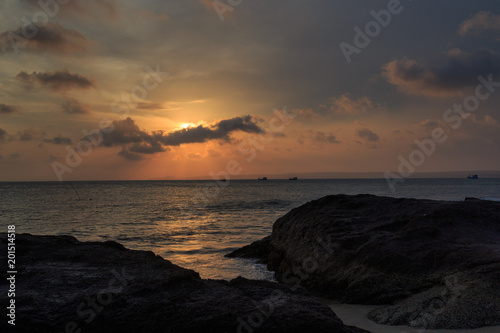 fishing boat to the sea at sunset