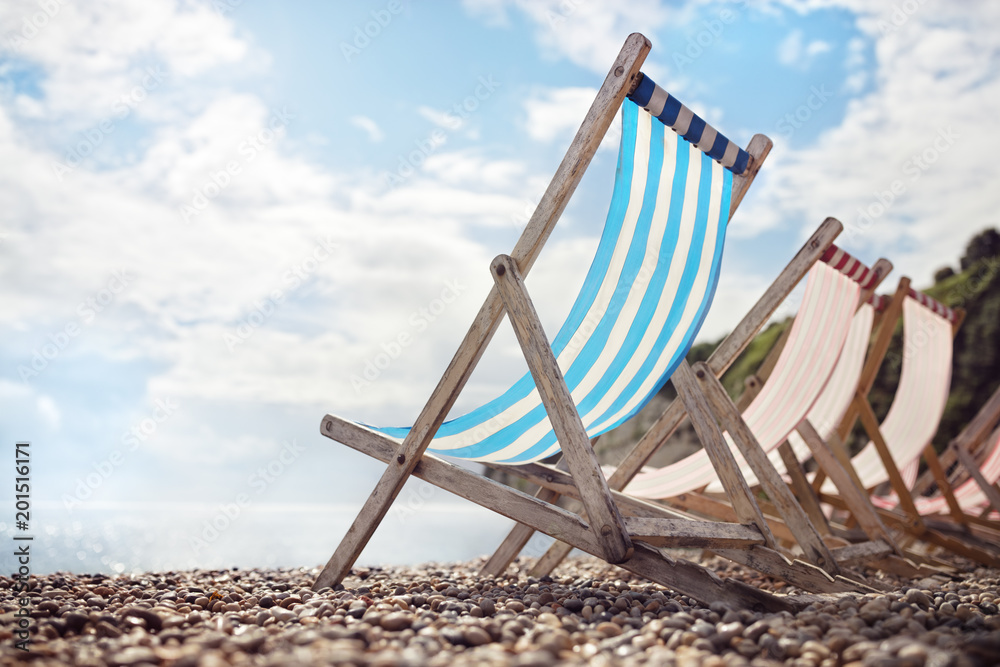 Summer vacation deck chairs on the beach at the seaside Summer vacation deck chairs on the beach at the seaside
