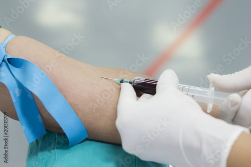 Nurse taking a blood sample for medical examinations