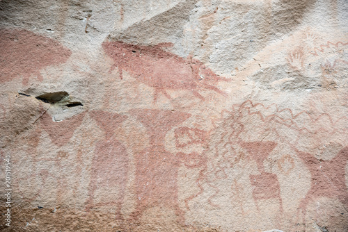 The prehistoric cave paintings dated back 3,000 years ago,Rock art on the cliffs, Surface of the cliffs are filled with numerous ancient paintings Ubon Ratchthani, Thailand. photo