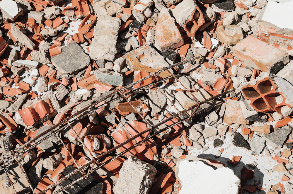 Debris of a demolished wall, demolition junk, broken concrete and pieces of masonry brick. Debris of a demolished wall, demolition junk, broken concrete and pieces of masonry brick.