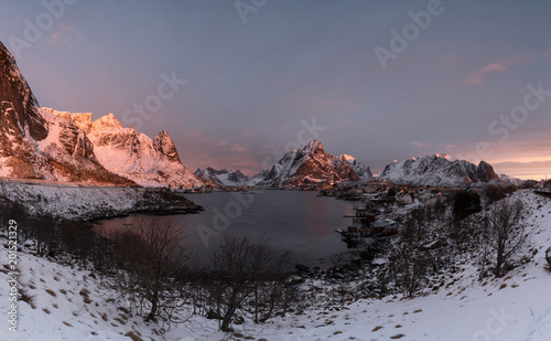 Reine Village in the morning with stunning sunrise scene of the day one of the most famous village in Lofoten , Norway / Travel concept / Landscape Photography