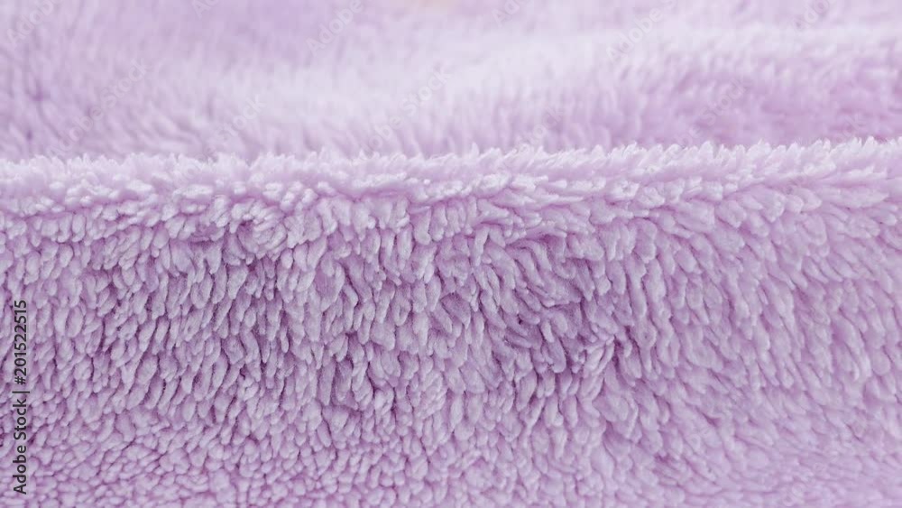 Terry lilac colored cloth towel texture as a background Terry lilac colored cloth towel texture as a background