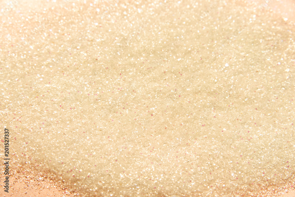 Classic shiny pastel peach glitter background with selective focus