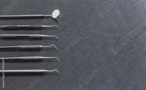 dental tools on gray background top view