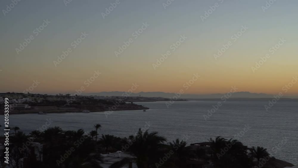 Rising Sun over the sea and desert mountains Rising Sun over the sea and desert mountains