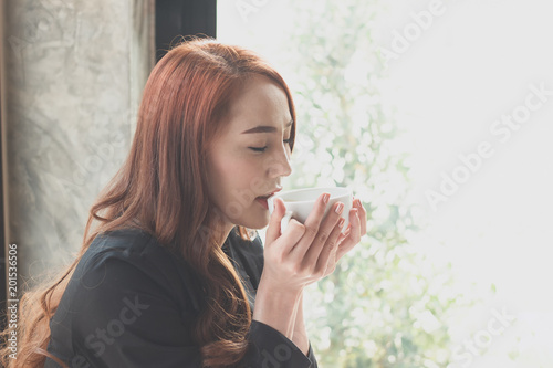 Young girl is drinking coffee at coffee shop,Businessmen are talking about work on a coffee shop.