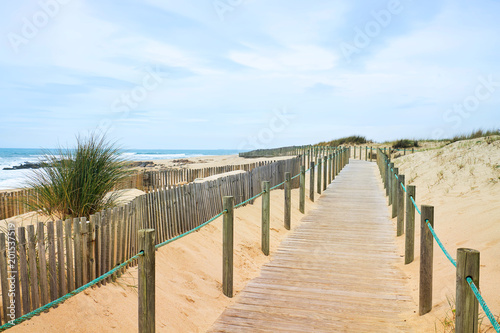Wooden path on the Atlantic beach with ocean view
