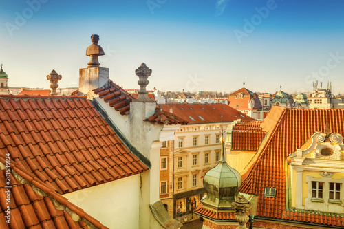 Cityscape view of the Old Town of Prague with famous red tiled roofs photo