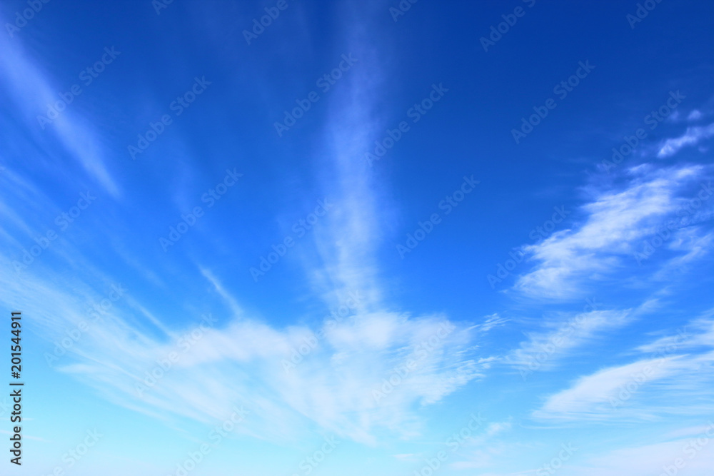 Blue sky and white cirrus clouds. Background. Landscape.