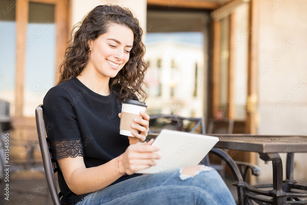 Woman social networking at cafe