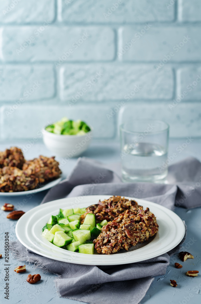 Pecan crust chicken breasts with cucumber's slices