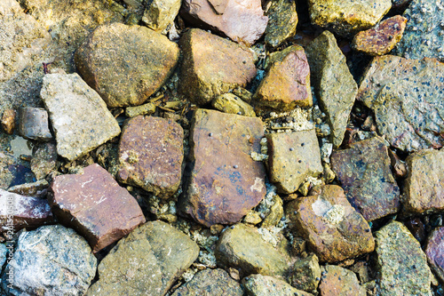 Beach sea rocks and old stone texture and background. warm color.