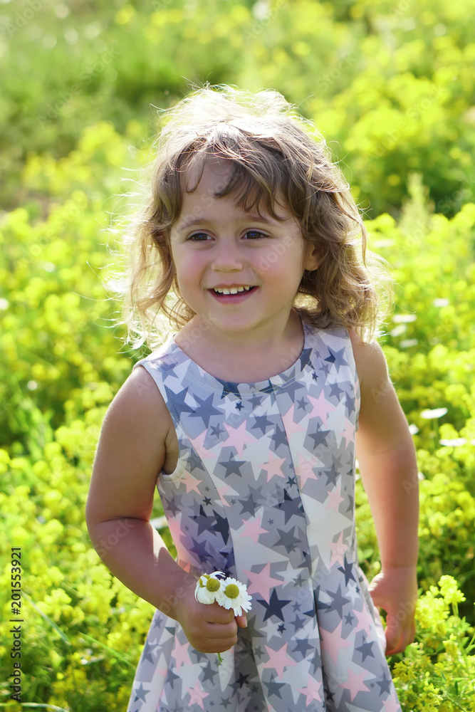 little girl in on a flower field little girl in on a flower field