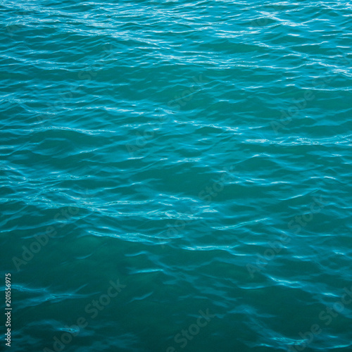 Black sea texture. Turquoise sea water with ripple. Peaceful nature minimal concept. © yolya_ilyasova