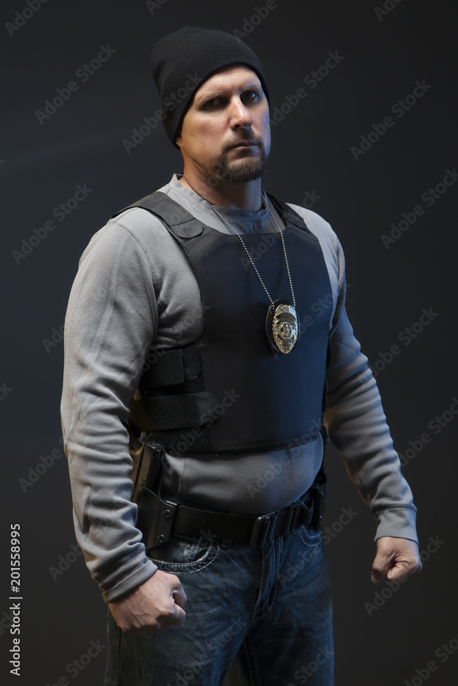 Officer that is angry with a badge and gun. Officer that is angry with a badge and gun.