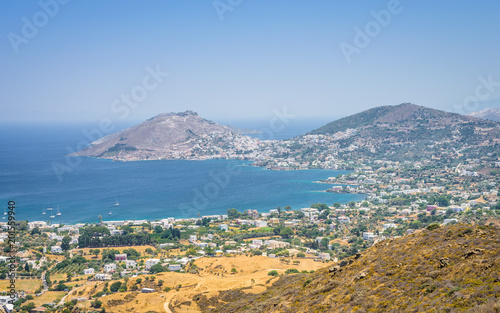 Leros Island, Dodecanese, Greece: Beautiful sunny coast view to the greek blue sea with crystal clear water beach with some boats fishing cruising surrounded by hills mountains Alinda city photo