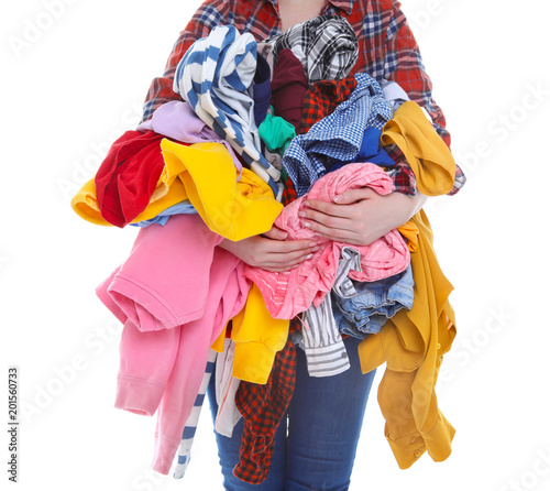 Woman holding dirty clothes on white background