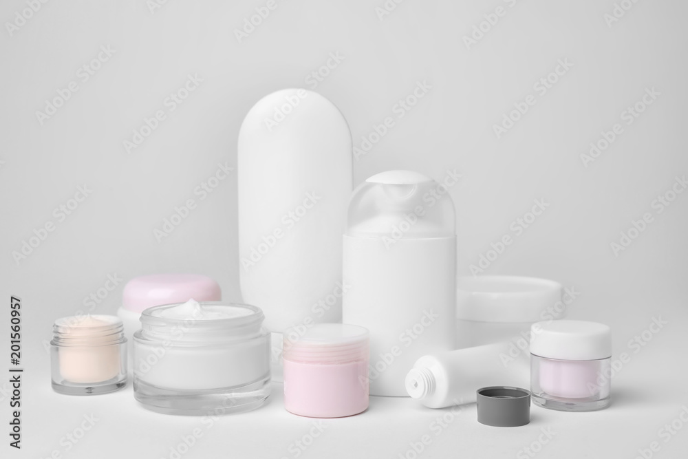 Composition with cosmetic products on light background Composition with cosmetic products on light background