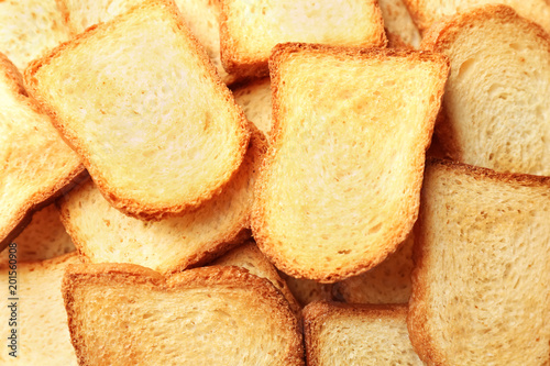 Toasted slices of bread as background, closeup