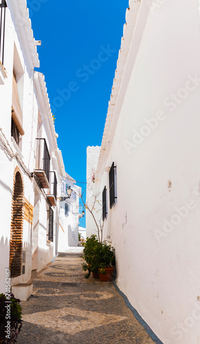 beautiful, picturesque street, narrow road, white facades of buildings, Spanish architecture © Q77photo