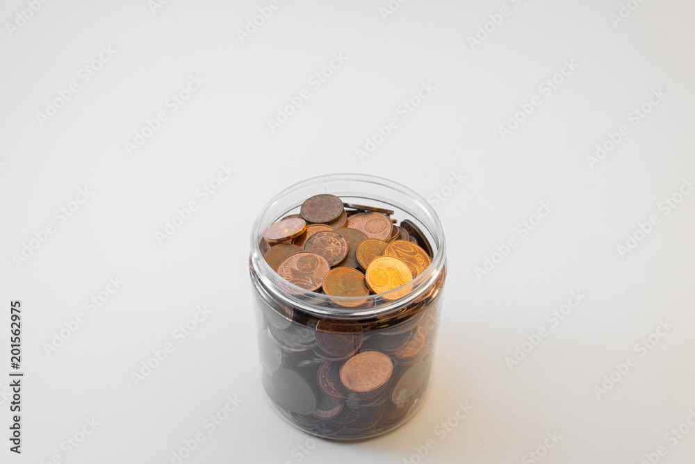 Isolated bunch of cent euro coins in transparent bottle on white background Isolated bunch of cent euro coins in transparent bottle on white background