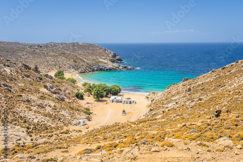 Obraz na płótnie Beautiful sunny coast view to the greek beach Psili Ammos and blue aegean sea with crystal clear water sandy beach with some boats fishing cruising small hills covering, Patmos, Dodecanese, Greece w salonie