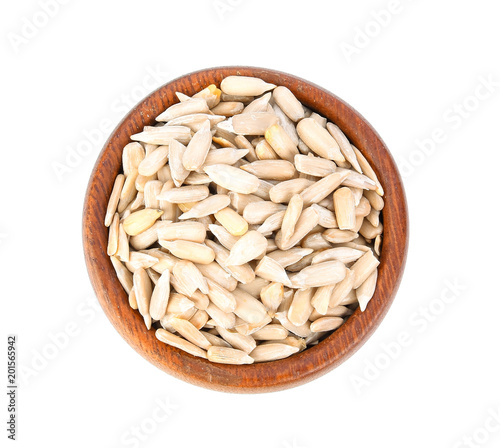 Sun flower seed on wood bowl isolated on white background