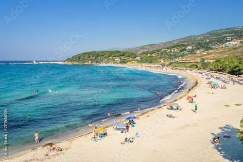 Fototapeta Naklejka Na Ścianę i Meble -  Sunny beautiful summer beach coast view to the greek blue sea white pure sand perfect for holiday relaxing swimming playing , Ikaria Island, Livadhi Beach, Messakti Beach, Armenistis , Sporades,Greece