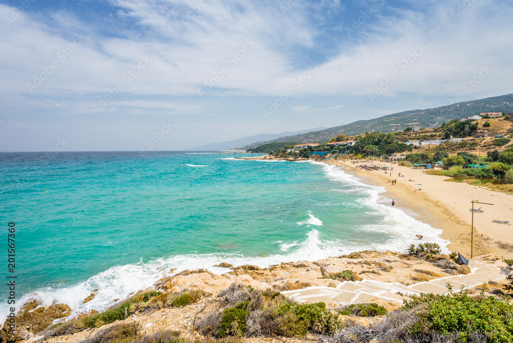 Sunny beautiful summer beach coast view to the greek blue sea white pure sand perfect for holiday relaxing swimming playing , Ikaria Island, Livadhi Beach, Messakti Beach, Armenistis , Sporades,Greece Sunny beautiful summer beach coast view to the greek blue sea white pure sand perfect for holiday relaxing swimming playing , Ikaria Island, Livadhi Beach, Messakti Beach, Armenistis , Sporades,Greece