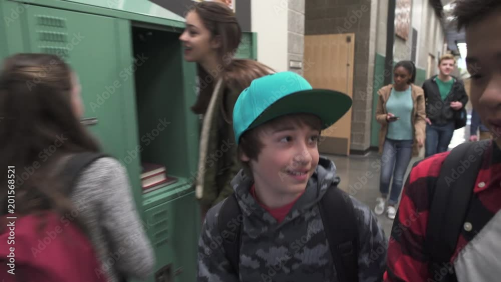 Medium shot of two friends talking on school corridor Medium shot of two friends talking on school corridor