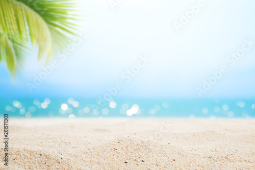 Fototapeta Naklejka Na Ścianę i Meble -  A seascape tropical beach. blur and bokeh light of seascape background, vintage color style. Focus on foreground.