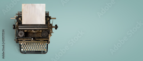 Vintage typewriter header with old paper. retro machine technology - top view and creative flat lay design. photo