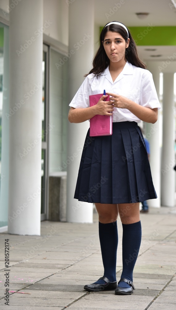 Standing Cute Colombian Female Student With Notebook