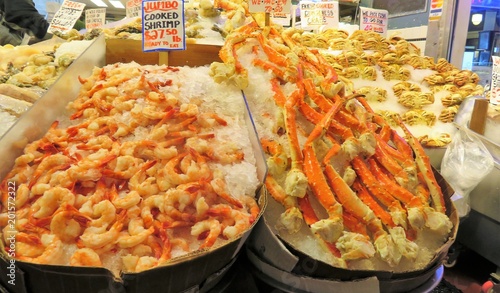 Fresh, shrimp and Alaskan king crab legs on ice at a fish market