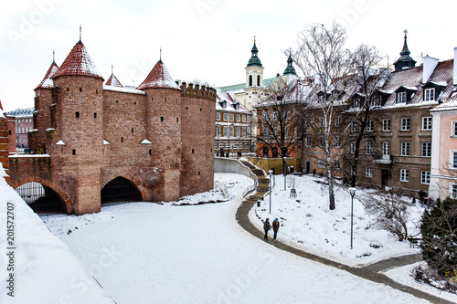 Warsaw Barbacan fortress castle in winter is in the capital city of Poland. Old town is the historic center of Warsaw. Sights of Poland. Snow day.