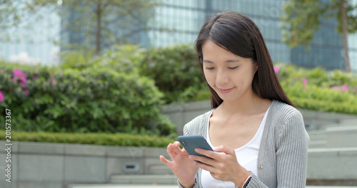 Photography Businesswoman use of smart phone in city