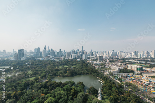    Bangkok cityscape in the morning with park in below  blue sky and cloud. 