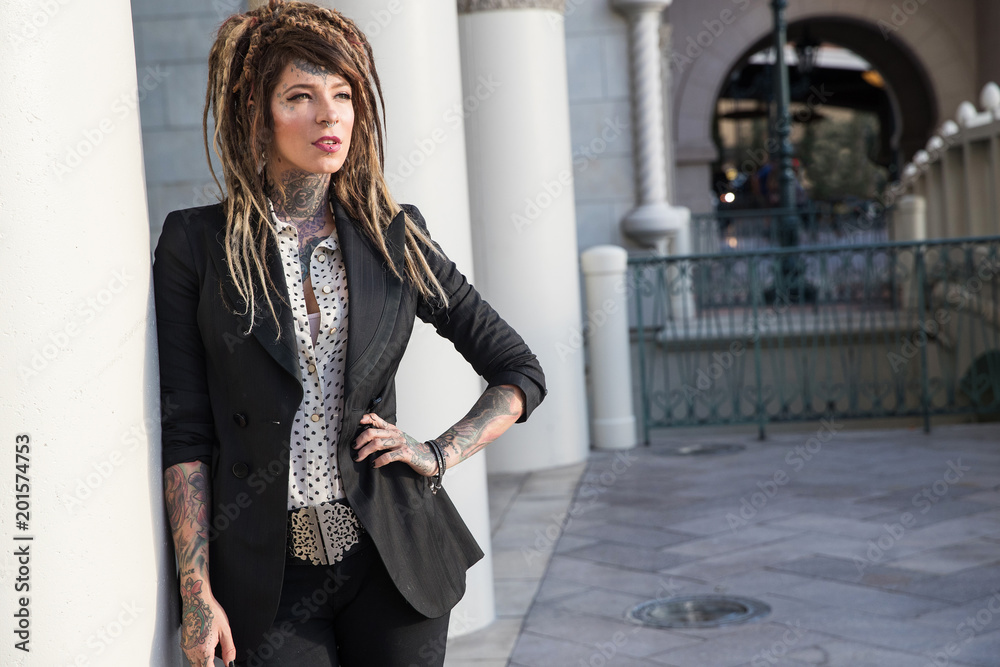 Beautiful woman with tattoo and dreadlocks wearing business suit Stock  Photo | Adobe Stock