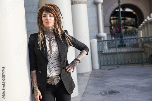 Valokuva Smart, successful business woman with tattoos and dreadlocks