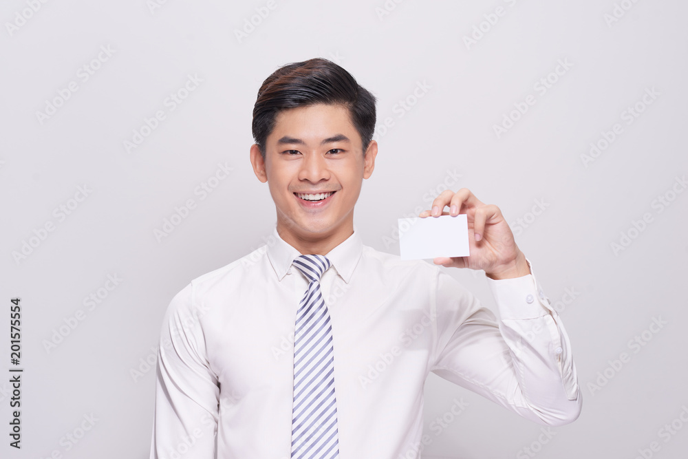 Young Man Holding Blank Visiting Card On white Background Young Man Holding Blank Visiting Card On white Background