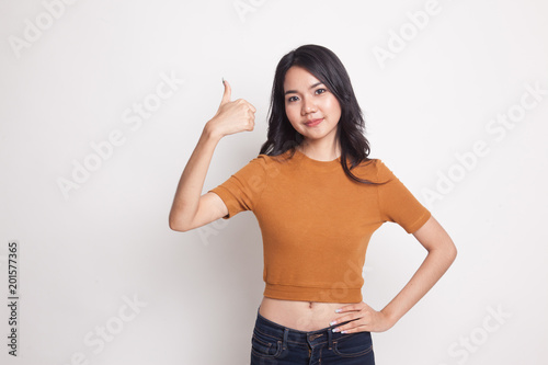 Young Asian woman show thumbs up.
