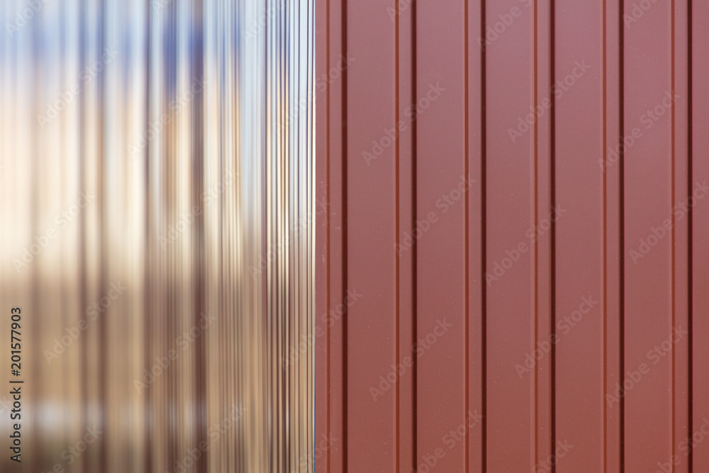 New metal fence made of metal profile as background New metal fence made of metal profile as background