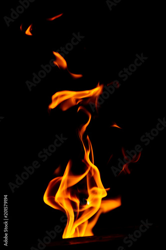 Red flame of fire on a black background © schankz