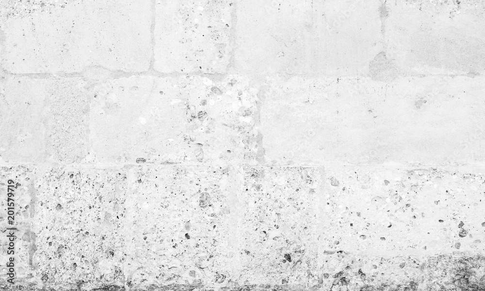 Fototapeta White stone wall, closeup background texture