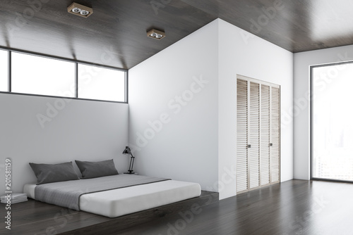 White and dark wooden bedroom corner