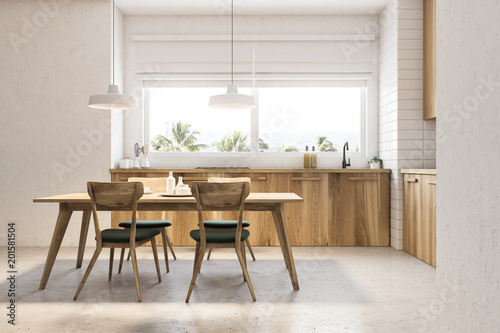 Side view of wooden kitchen and dining room